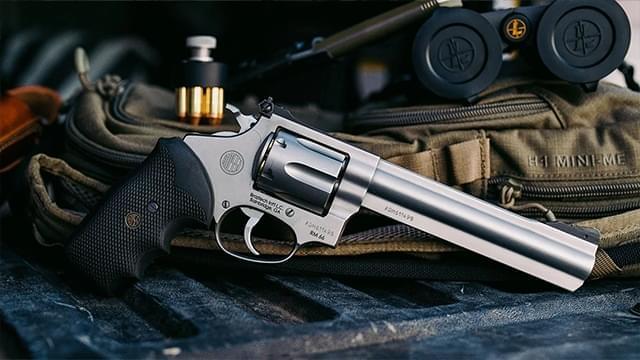 Revolver on range bag with ammunition