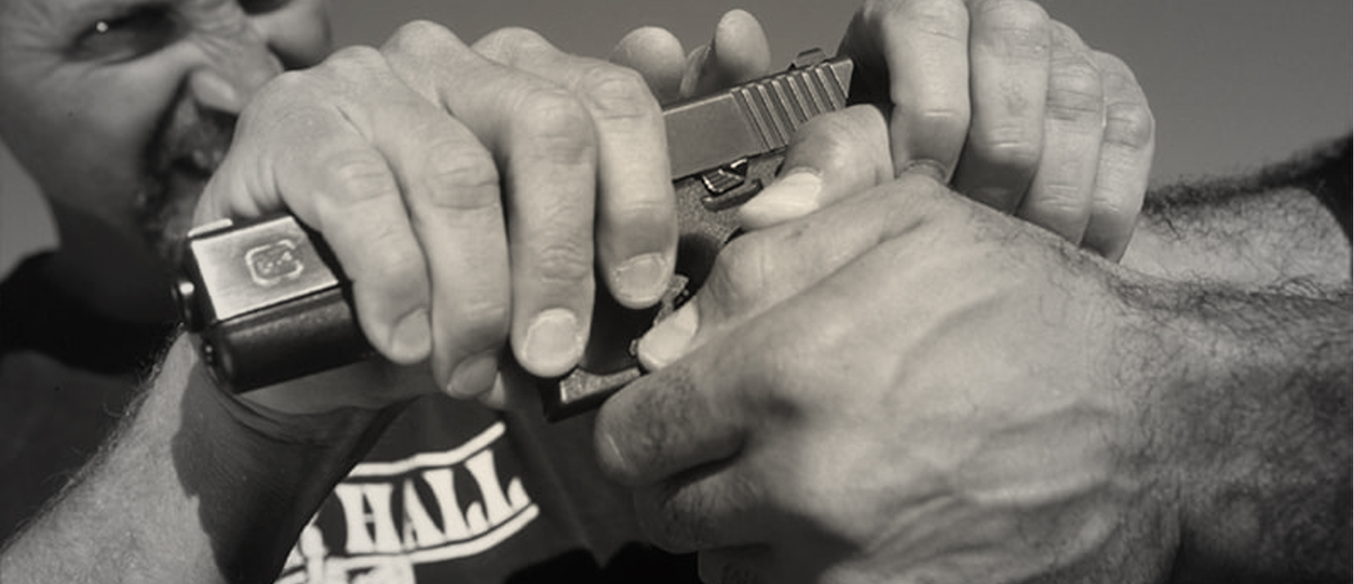 Two men fighting over a handgun