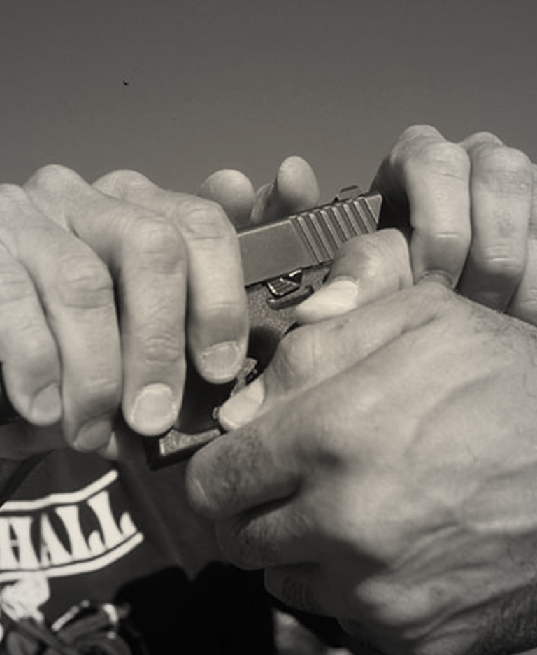 Two men fighting over a handgun