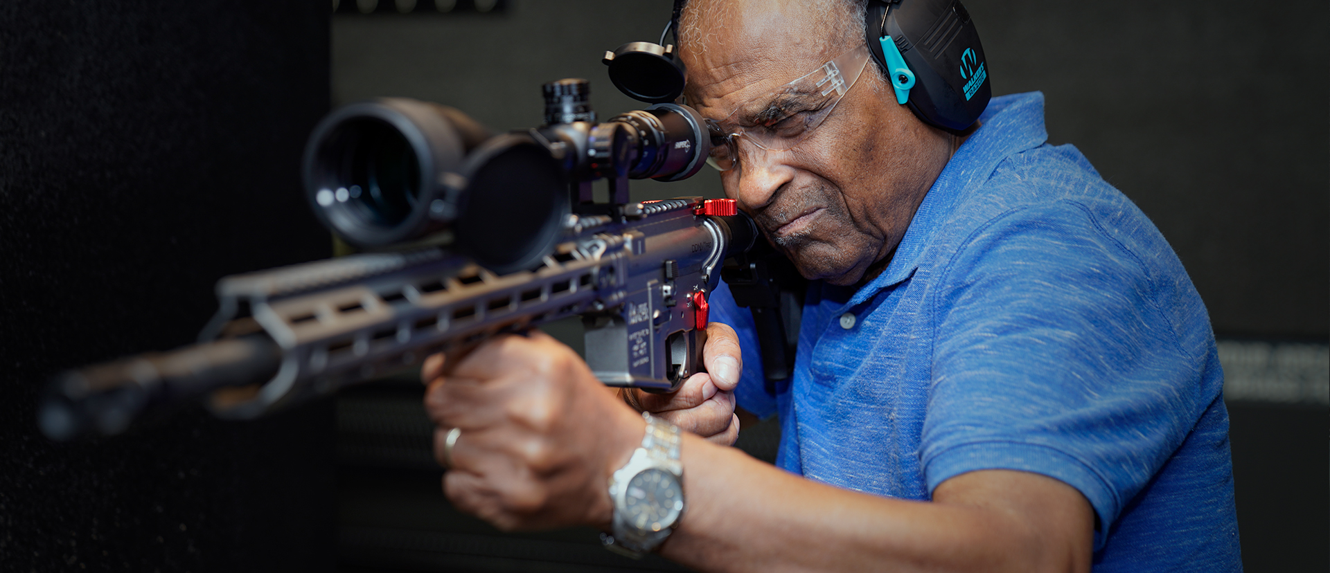 Man shooting rifle